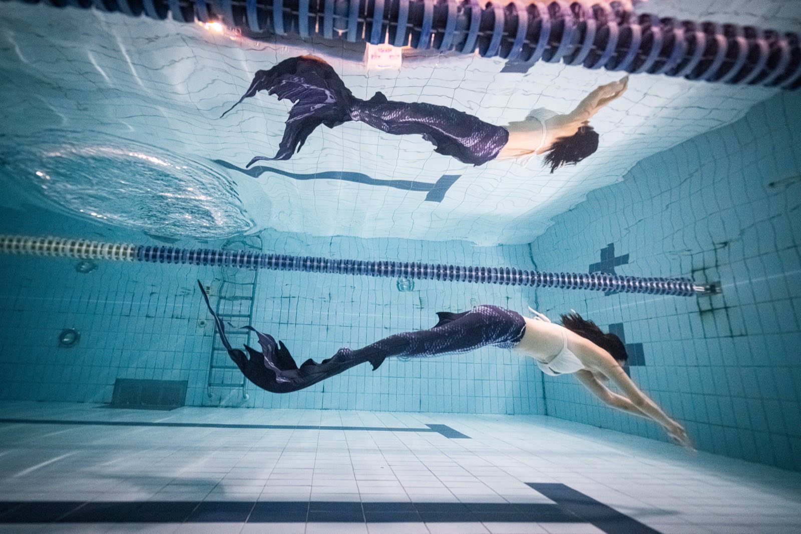 Freediving and mermaid photography in an indoor pool