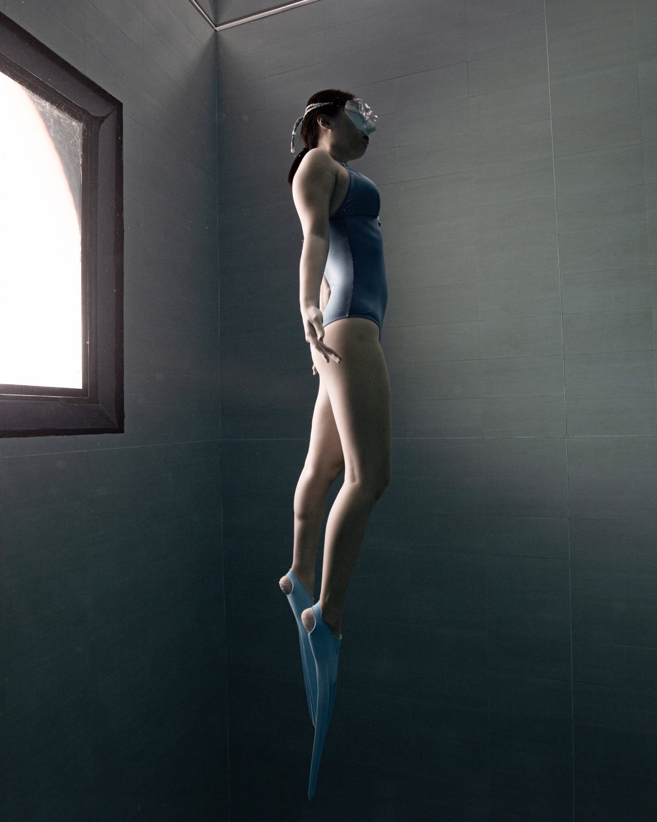 Freediving and mermaid photography in an indoor pool