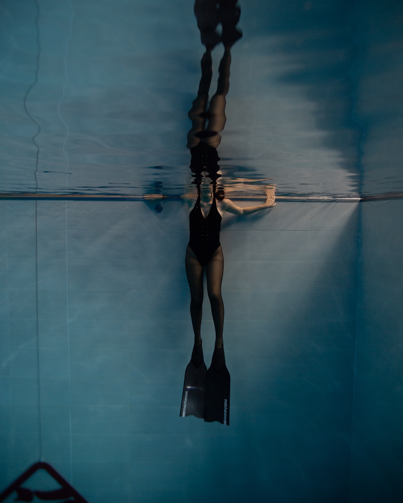 Freediving and mermaid photography in an indoor pool